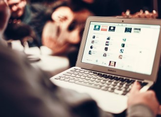 person using apple laptop notebook